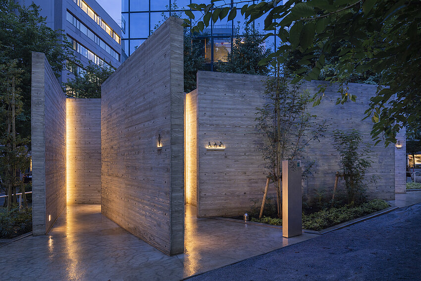 A toilet house that looks like the entrance to a maze.