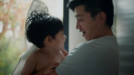 Child in the arms of his dad