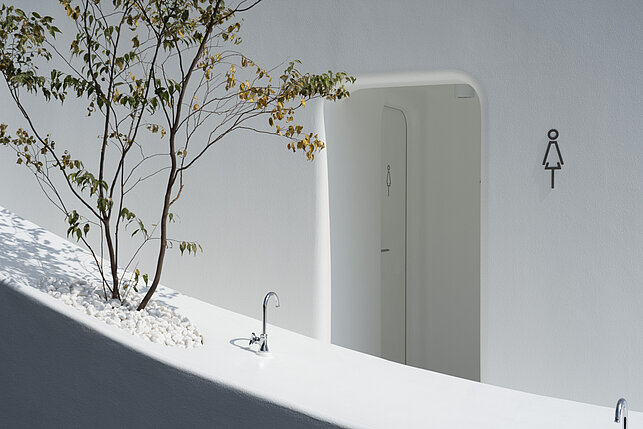 Exterior view of toilet in Nishisando, close up of women's toilet. 